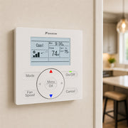 Daikin wired mini split controller installed on wall inside modern home