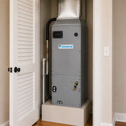 Daikin SkyAir ducted mini split air handler installed inside residential utility closet with connected ductwork