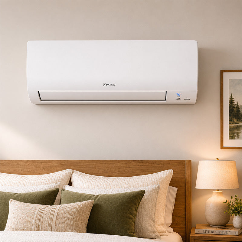 Daikin wall-mounted mini-split air handler installed in a bedroom for heating and cooling comfort.